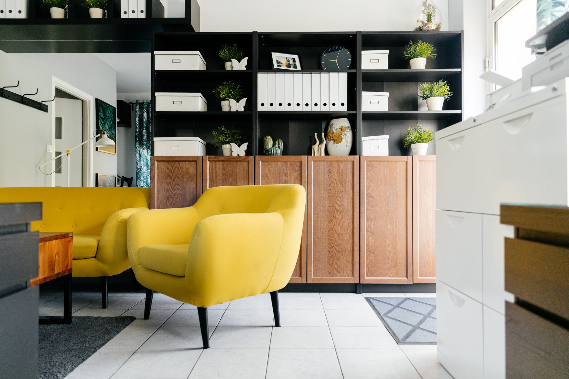 neutral office cabinets with yellow chairs