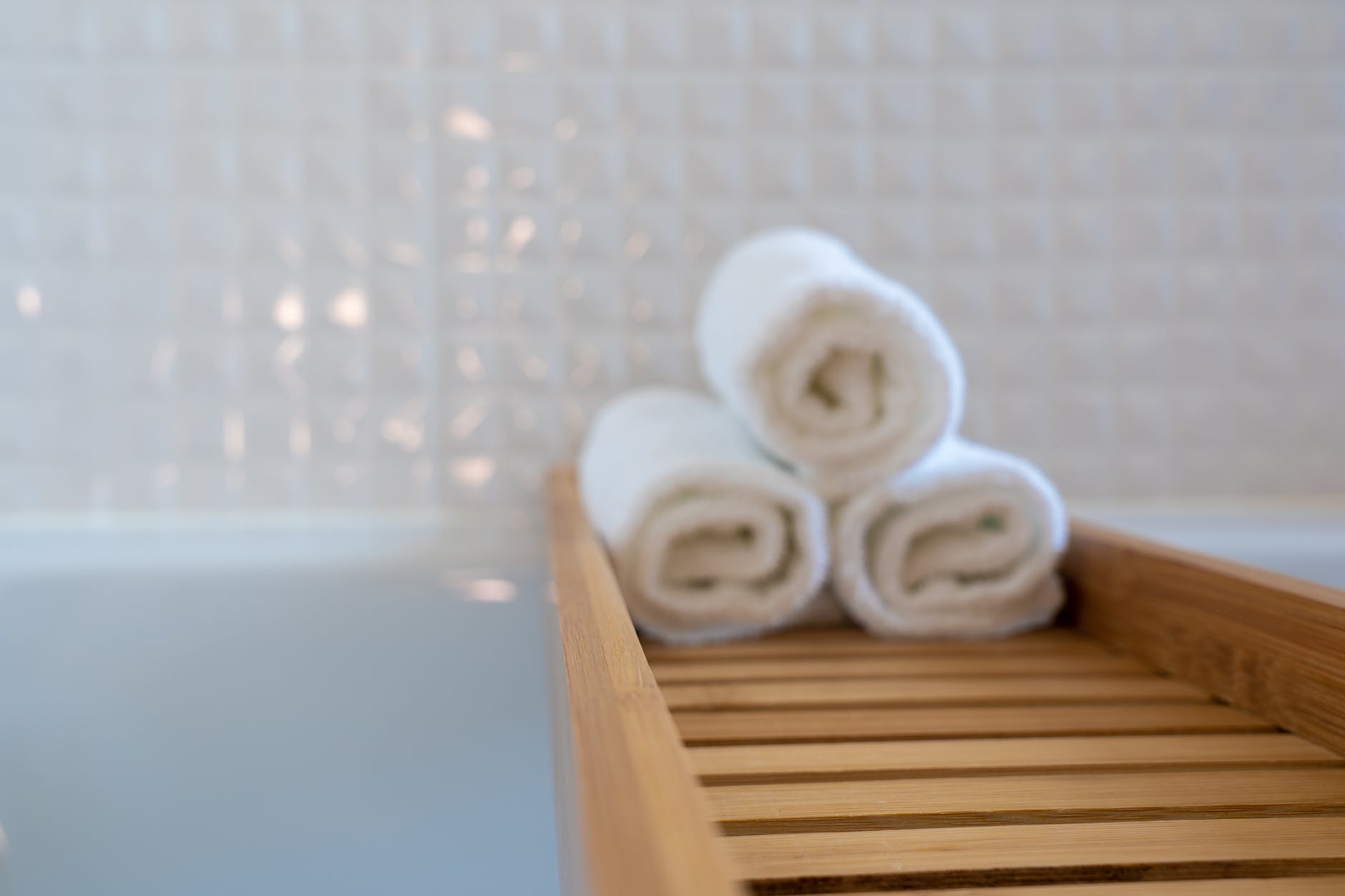 three rolled towels on bathtub try